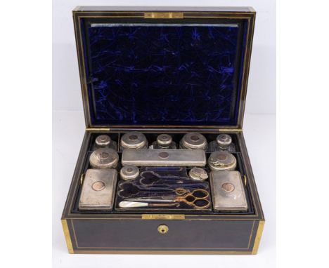 A 19th century Victorian coromandel cased travelling dressing table set, the outer case with brass banding and mounts, with c