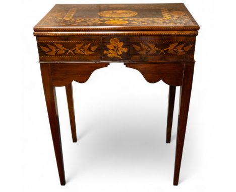 A 19th century Irish Killarney marquetry and mahogany games table, with hinged rectangular top decorated with a central ruine