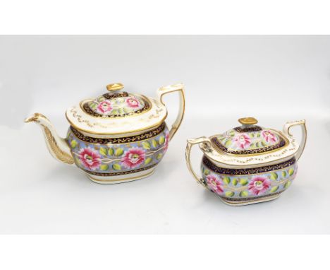 An early 19th century teapot and cover and matching sucrier and cover, painted with flowers and leaves on a pale blue ground.