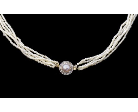 An Edwardian seed pearl and diamond choker, comprising five rows of seed pearls,each measuring approx 1.15-1.27mm, strung to 
