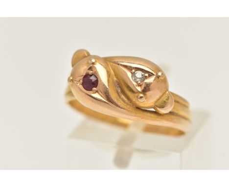 AN 18CT GOLD SNAKE RING, designed as two snakes intertwined, one set with an old cut diamond the other set with a circular cu