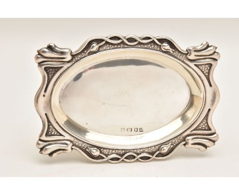 AN ART NOUVEAU SILVER TRINKET DISH, of an oval form, embossed with a floral patterned rim, hallmarked 'A &amp; J Zimmerman Lt