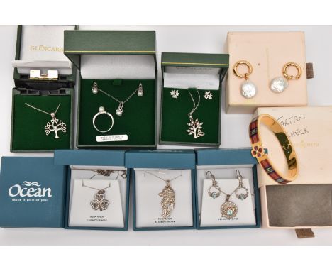 AN ASSORTMENT OF CELTIC STYLE JEWELLERY, to include three white metal necklaces, two white metal necklace and earring sets an