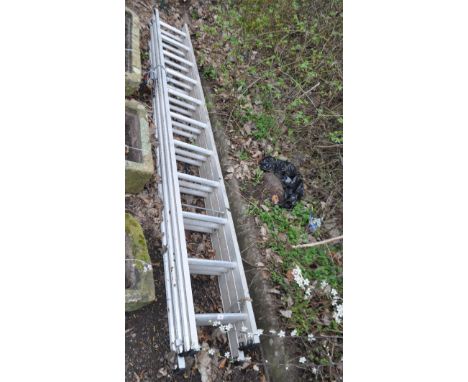 AN ABRU ALUMINIUM TRIPLE EXTENSION LADDER, with eleven rungs to each 300cm length, full extension height 740cm