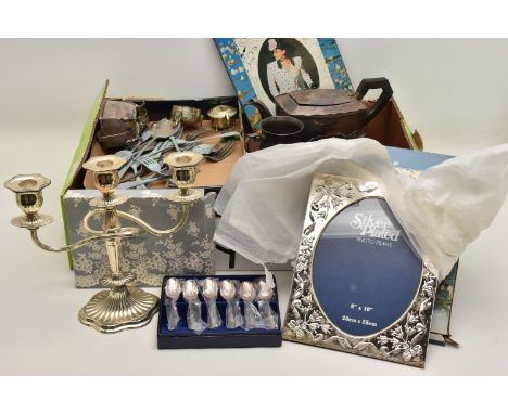 A BOX OF ASSORTED WHITE METAL WARE, to include a three branch candle stick, two boxed silver plate photo frames, EPNS teapot,