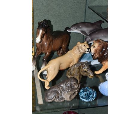 A GROUP OF ANIMAL AND BIRD FIGURES, comprising a Beswick Cantering Shire no 975, Lion no 2089 and Lioness no 2097, a Minton D