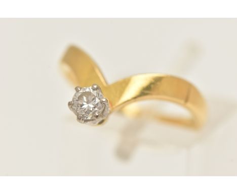 AN 18CT GOLD SINGLE STONE DIAMOND RING, set with a round brilliant cut diamond, six claw set within a raised white metal moun