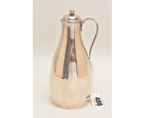A LATE VICTORIAN SILVER JUG, baluster polished form with open work handle, with a removable cover, hallmarked London 1890, ma