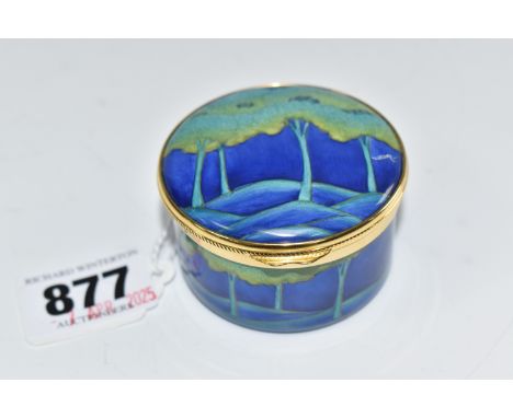 A MOORCROFT 'MOONLIT' ENAMEL CIRCULAR TRINKET POT with gilt metal rims, a hand painted forest scene to the lid, and a tree mo