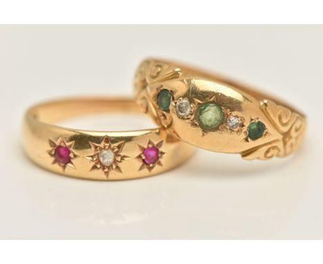 TWO EARLY 20TH CENTURY RINGS, the first an 18ct yellow gold ring set with emeralds and diamonds, with scrolling detail, hallm