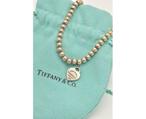 A 'TIFFANY &amp; CO' BEAD LINK BRACELET, fitted with a lobster clasp, stamped 925, a small circular tag stamped 'AG 925' sign