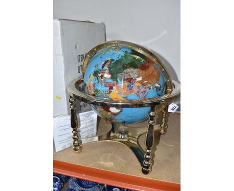 A BOXED GLOBE 'GEMSTONE GLOBE' IN A ROTATING CRADLE with a compass fitted to the lower part of the gilt metal cradle, countri