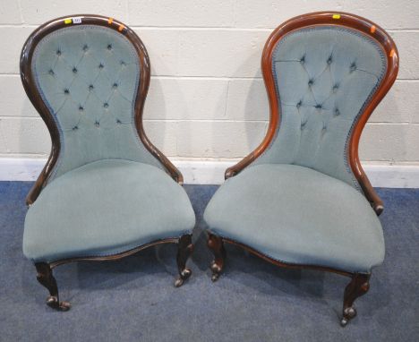 TWO SIMILAR VICTORIAN SPOON BACK CHAIRS, with light blue buttoned upholstery, raised on front cabriole legs, with castors, wi