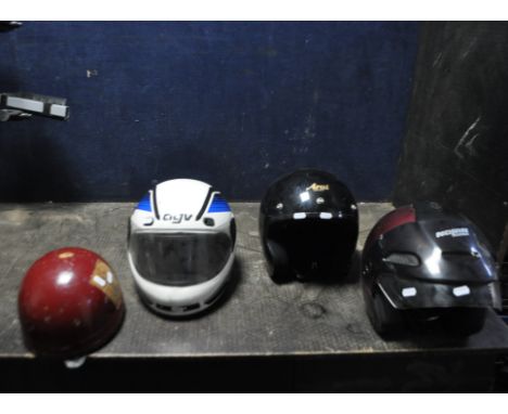 FOUR MOTORCYCLE HELMETS, including a vintage Aviakit Trackstar helmet, an AGV full faced helmet (Large), an Aria Type A helme