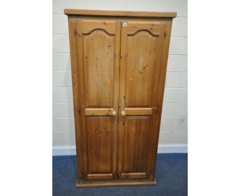 A MODERN PINE DOUBLE DOOR WARDROBE, width 96cm x depth 52cm x height 191cm, condition report: marks, scuffs, discolouration, 