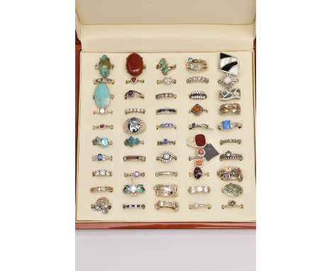 AN ASSORTMENT OF SILVER AND WHITE METAL GEM SET RINGS, to include five silver rings, each with UK hallmarks, approximate gros