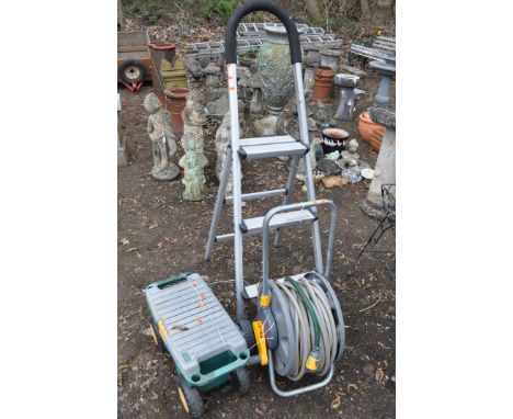 AN ALUMINIUM STEP, A HOSE REEL AND A ROLLING TOOL CHEST, containing tools (3)