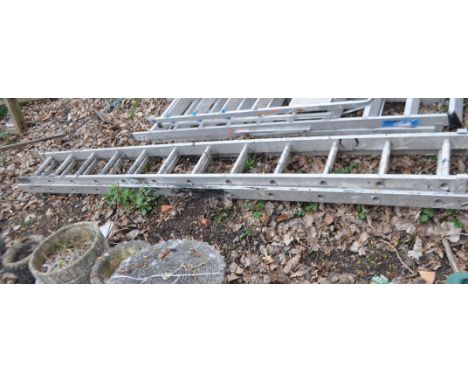 AN ALUMINIUM DOUBLE EXTENSION LADDER, with twelve rungs to each 340cm length