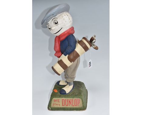 A DUNLOP CADDIE ADVERTISING FIGURE on a square naturalised base, 'We Play Dunlop' written on two panels, '6 Dunlop 6' printed