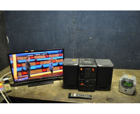 A JVC 24in LED SMART TV WITH REMOTE (stand not attached), a Daewoo mini hi fi Tape not playing) and a Roberts clock radio/CD 