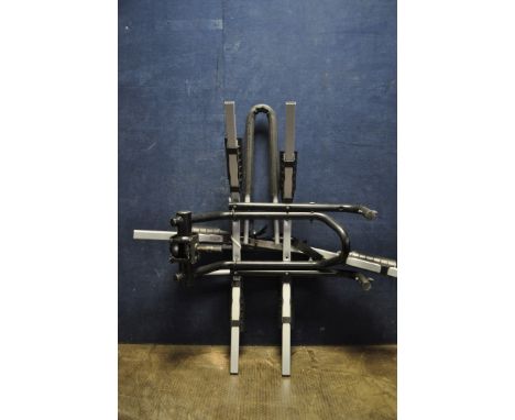 A POSSIBLY THULE CAR BIKE RACK, with towbar attachment and three 'treads' (one detached)