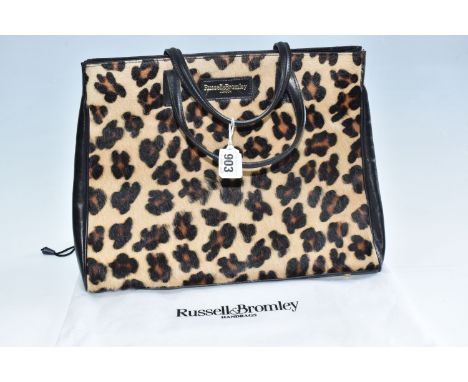 A RUSSELL &amp; BROMLEY HANDBAG, a faux leopard print design tote bag, with a white original dust bag, height 28.5cm x width 