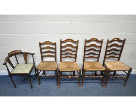 A PAIR OF OAK RUSH SEATED LADDER BACK CHAIRS, raised on shaped legs, with turned stretchers, two other rush seated chairs, al