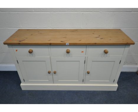 A MODERN PARTIALLY PAINTED SIDEBOARD, fitted with three drawers, over three cupboard doors, length 150cm x depth 47cm x heigh
