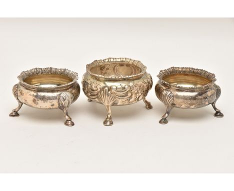 THREE SILVER SALTS, to include a pair of cauldron shape salts with gadrooned rims and raised on three cabriole legs, hallmark