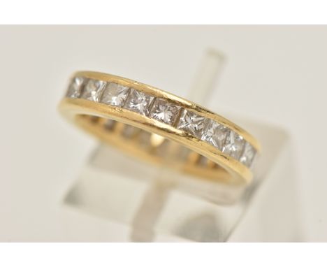 AN 18CT GOLD DIAMOND FULL ETERNITY RING, designed as twenty three princess cut diamonds, channel set in yellow gold, approxim