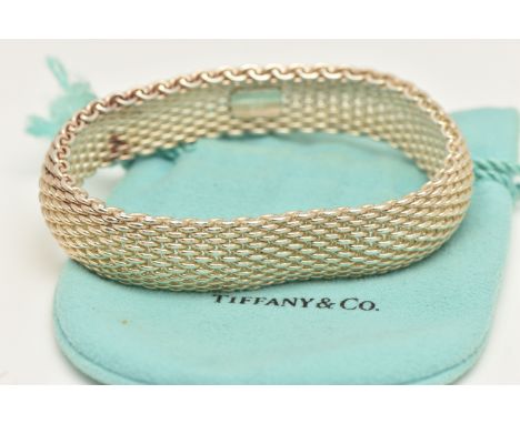 A 'TIFFANY &amp; CO' MESH BRACELET, approximate width 15mm, signed 'Tiffany &amp; Co 925' to a tag on the inside, approximate