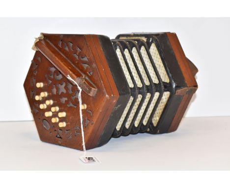 A TWENTY ONE KEY CONCERTINA, stamped 'Trade Mark, English Make', with fretwork ends and bone keys, approximate diameter 15.5c