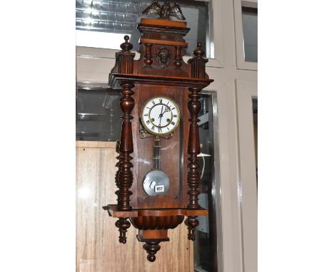 A VIENNA STYLE WALL CLOCK, eight day movement, mahogany case with eagle finial and fluted columns, enamelled dial marked with