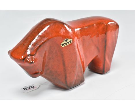 A MID-CENTURY BAY WEST GERMAN BULL SCULPTURE of an abstracted form with a red glaze, 'Bay' sticker to the one side, height 13
