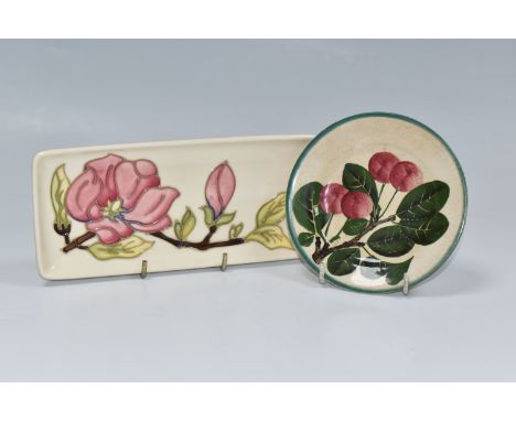 A MOORCROFT POTTERY RECTANGULAR 'MAGNOLIA' TRINKET DISH, pink magnolia on a cream ground, an impressed maker's mark on the ba