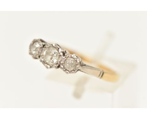 A THREE STONE DIAMOND RING, three old cut diamonds, prong set in a white metal illusion setting, approximate total diamond we
