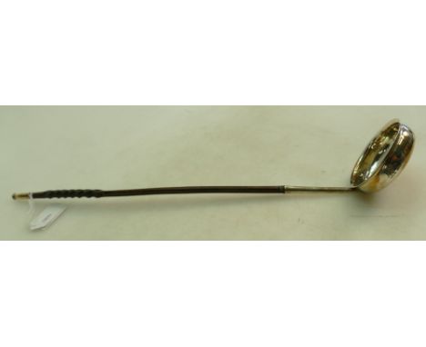 Toddy ladle with silver coloured metal bowl and long twisted handle, bearing armorial crest: