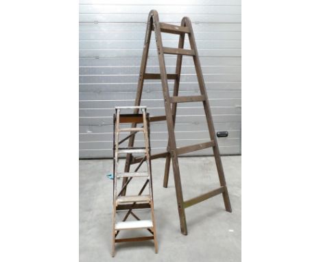 Vintage set of pine ladders together with larger similar item. (2)