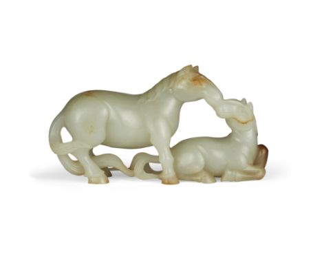 A Chinese pale celadon and russet jade 'horses' groupQing dynasty, 19th centuryDelicately carved as a mare and her foal, the 