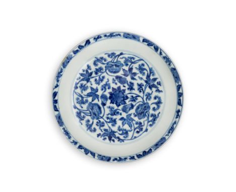 A Chinese blue and white 'peony' dishQing dynasty, Kangxi period, apocryphal Jiajing six-character markDelicately painted to 