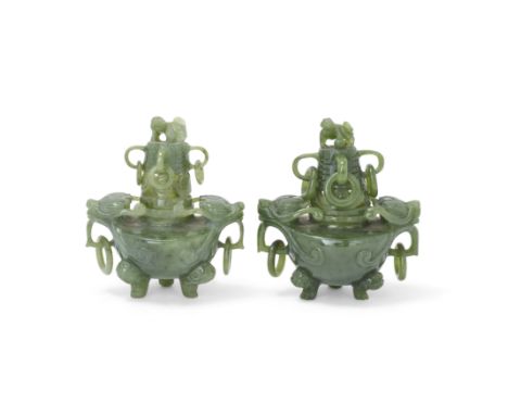 A pair of small Chinese spinach jade tripod incense burners and pierced coversLate Qing dynastyEach with lion head tripod fee