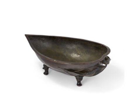 A large Chinese bronze 'peach' shallow vesselQing dynasty, 18th/19th centuryCast as a half peach with leafy tendril handle, s