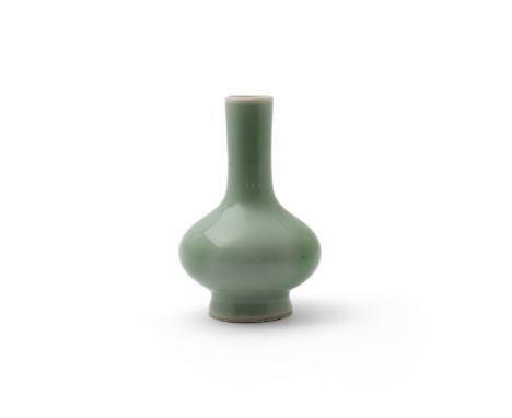 A Chinese celadon glazed bottle vaseQing dynasty, 18th centuryWith a tall splayed foot rising to compressed bulbous sweeping 