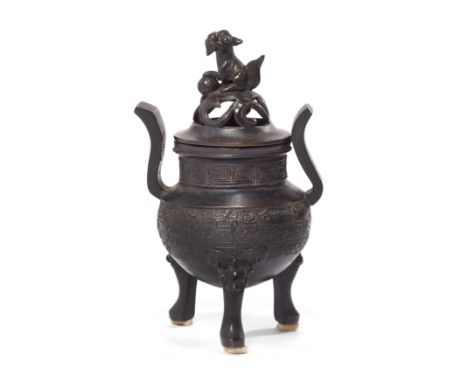 A Chinese bronze tripod incense burner and reticulated cover, dingQing dynasty, 17th centuryStanding on three tall mythical b