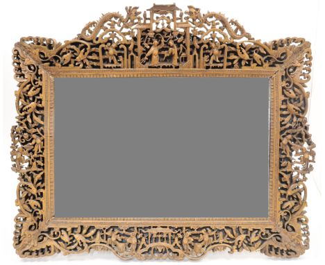 Two Chinese carved boxwood mirrors20th centuryEach with elaborate openwork carved borders featuring figures, dragons, archite
