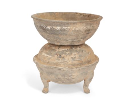 A Chinese two-part painted pottery food warming vesselHan dynastyThe tripod ding-shaped vessel of compressed globular form ri