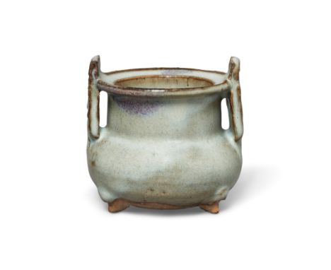 A small Chinese Junyao purple-splashed tripod censerYuan dynastyThe squat vessel standing on three small conical feet, the gl