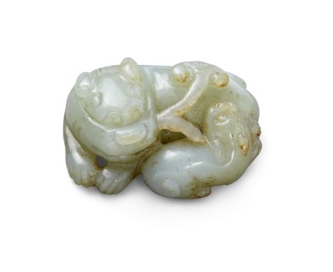 A Chinese green jade carving of a lion and cubQing dynasty, 19th centuryThe recumbent lions holding a sprig of lingzhi in the