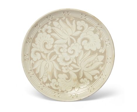 A Chinese Cizhou-style carved slip 'lotus' dish20th centuryThe heavily potted vessel with carved slip decoration of stylised 