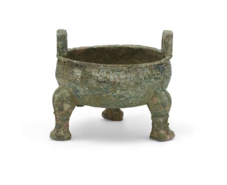 A Chinese archaistic ritual tripod food vessel, ding20th centuryCast in the Western Zhou style with compressed globular body 